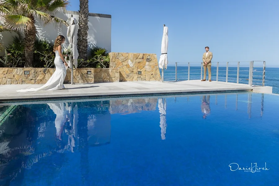 Aerial view of couple by the pool